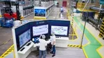 Workers at the Unilever factory, Brazil, use technology to improve efficiency.